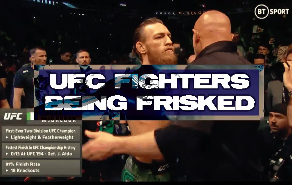 Conor McGregor is frisked by a UFC official.