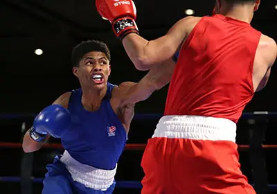 Two amateur boxers without headgear at the Olympic games 2016.