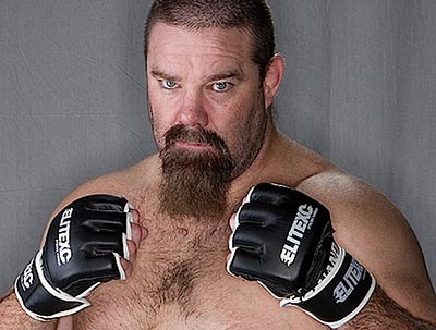 David Tank Abbott was a UFC heavyweight fighter here wearing some 4oz MMA gloves he helped to promote in the sport.