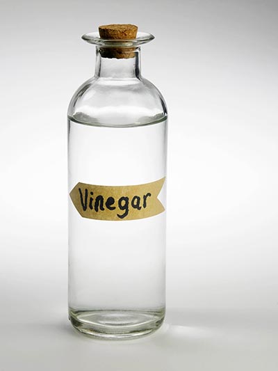 White vinegar that can be used to clean boxing gloves thoroughly inside and out.
