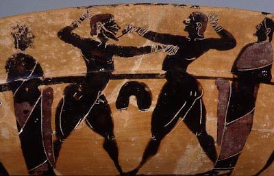 An ancient Sumerian wall drawing which shows fighters with cloth wrapped hands during a bout.
