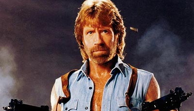 World-famous action movie star legend Chuck Norris with two guns.