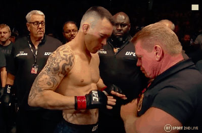 Chaos Colby Covington is frisked outside the octagon.