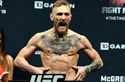 Simultaneous two-division UFC champion Conor McGregor weighs in for a featherweight clash.