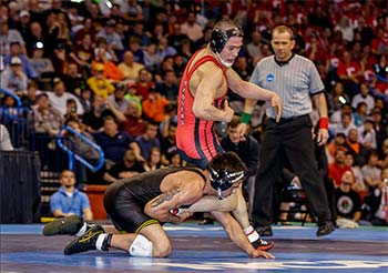 Two wrestling students competing at the 2014 NCAA wrestling finals.