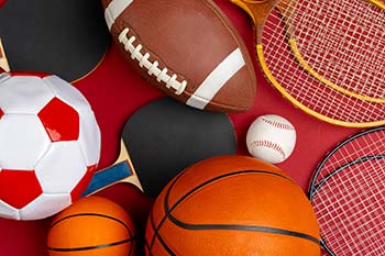 A composition of various sports equipment for fitness.