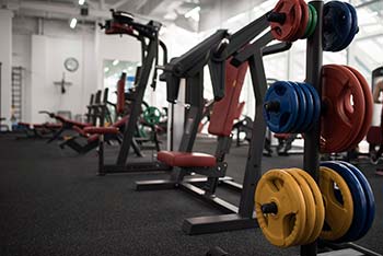 A selection of exercise weights inside a gymnasium.