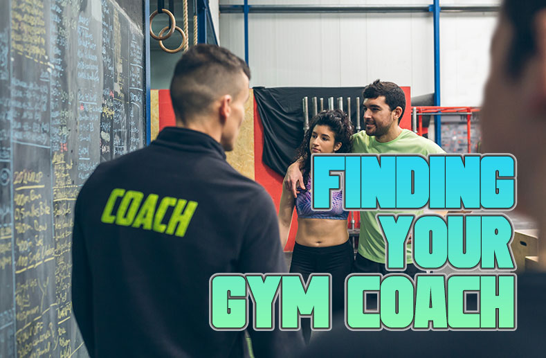 A couple listening to their gym coach give advice.