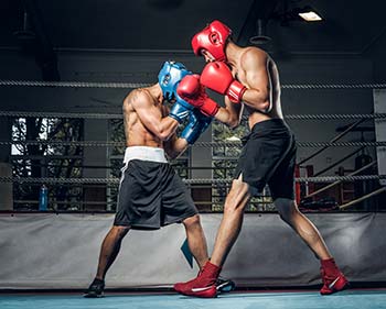 Two boxers fighting during a boxing competition